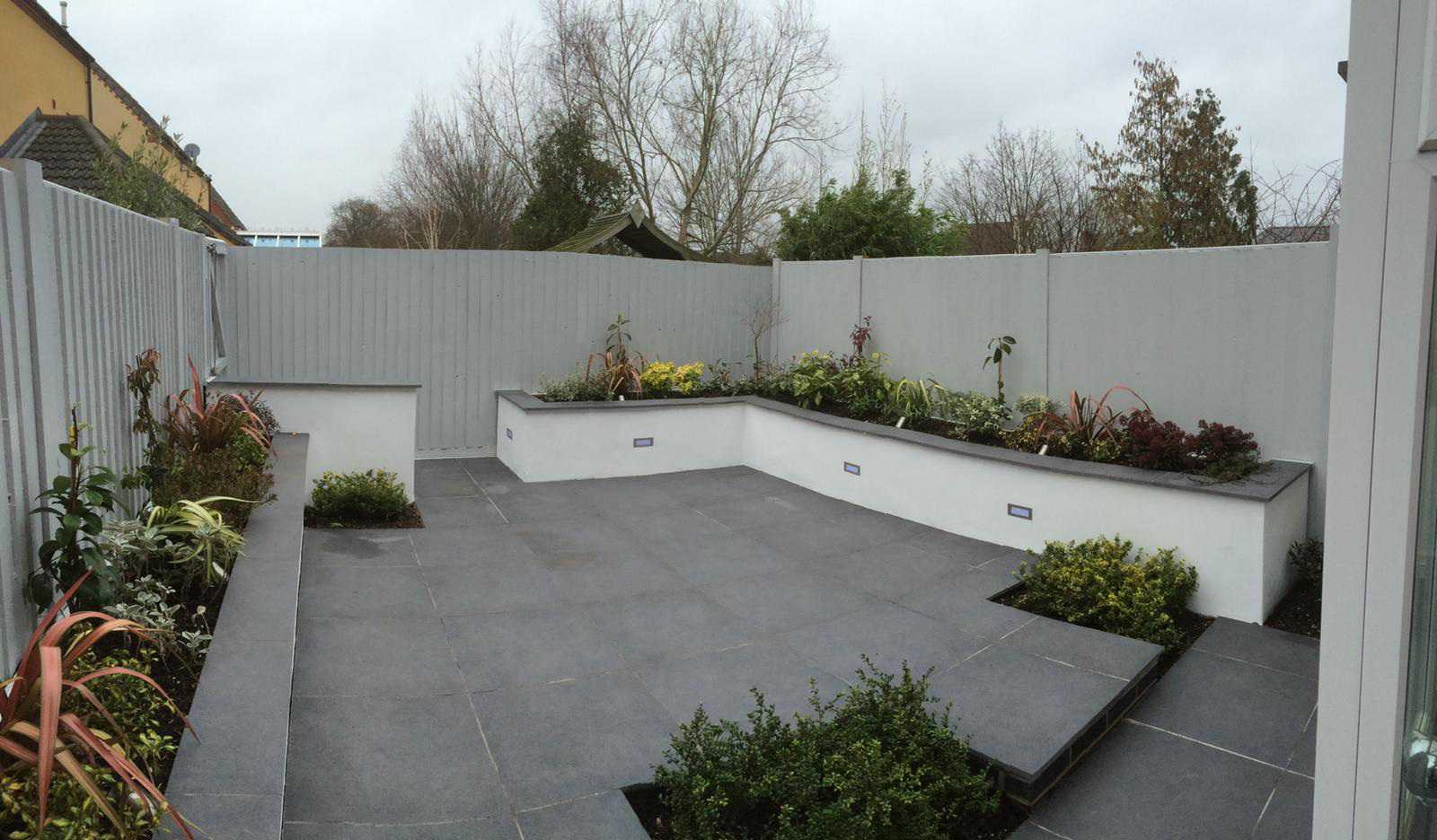 Grey slabs with raised beds - Landscaping large garden - Landscapes portfolio by Martyn Powell Landscapes in Cheltenham